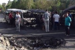 Iraqi officials say car bomb blast kills 14 people northeast of Baghdad